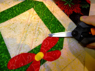 snipping threads at the beginning and end of quilting