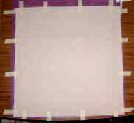 machine quilting - tape backing taut