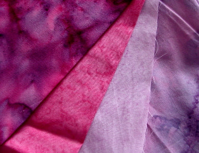 a selection of pink and purple Hoffman fabric watercolors