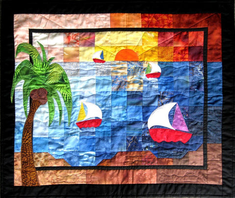 Sunset sails is a small wallhanging quilt made in a color wash design. This quilt is designed by Emma McFarland