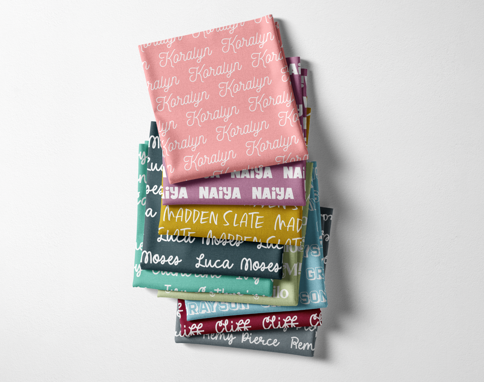 stack of custom name baby blankets