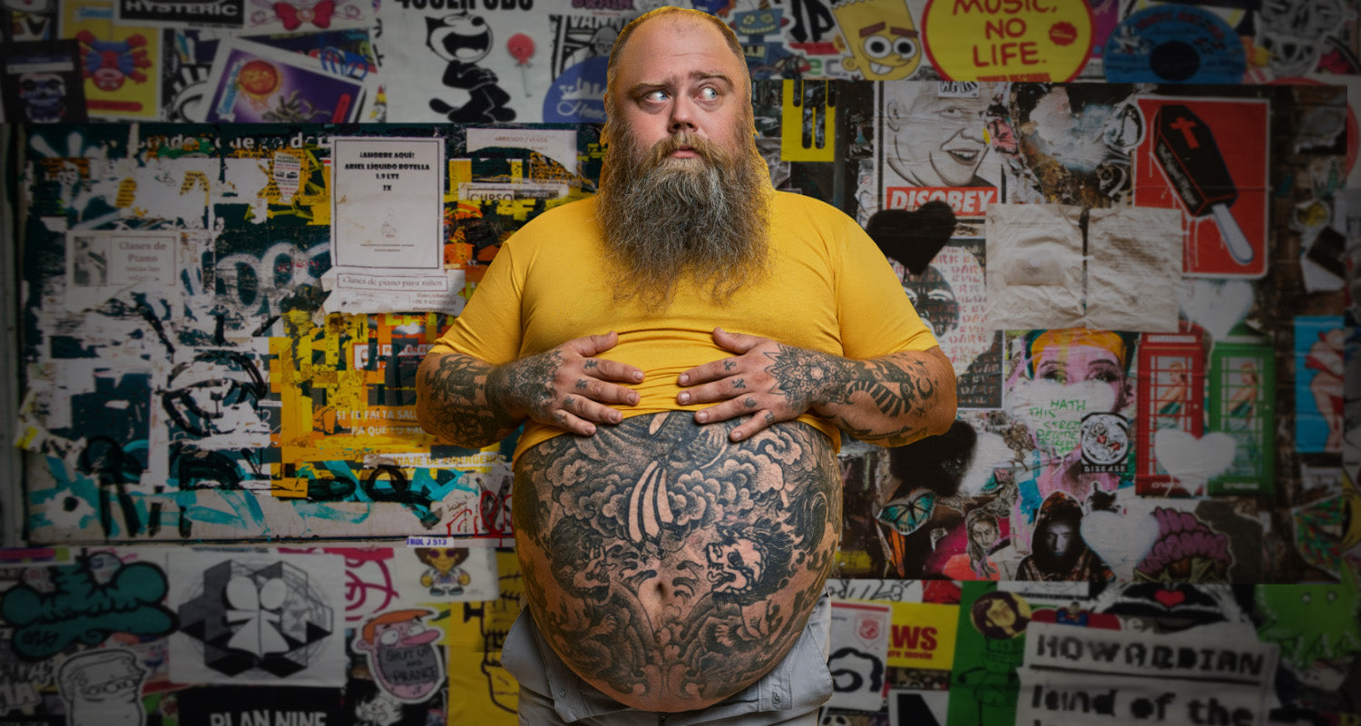 fat tattooed man in tight shirt