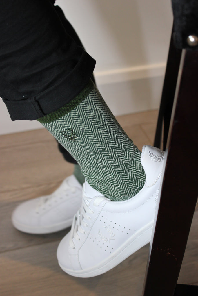 Green socks and white trainers