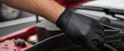 Black nitrile glove inside car