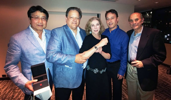 Kathy Switzer wearing Pierre Laurent, Left to Right Paul Kwong, Jay Cameron, Katherine Switzer, her manager, and Roger Robinson, her husband