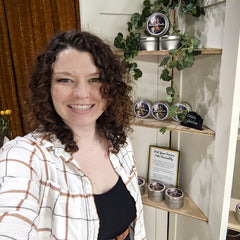 Lindsey Keeley stands in front of her Skinny Dip Candle display.