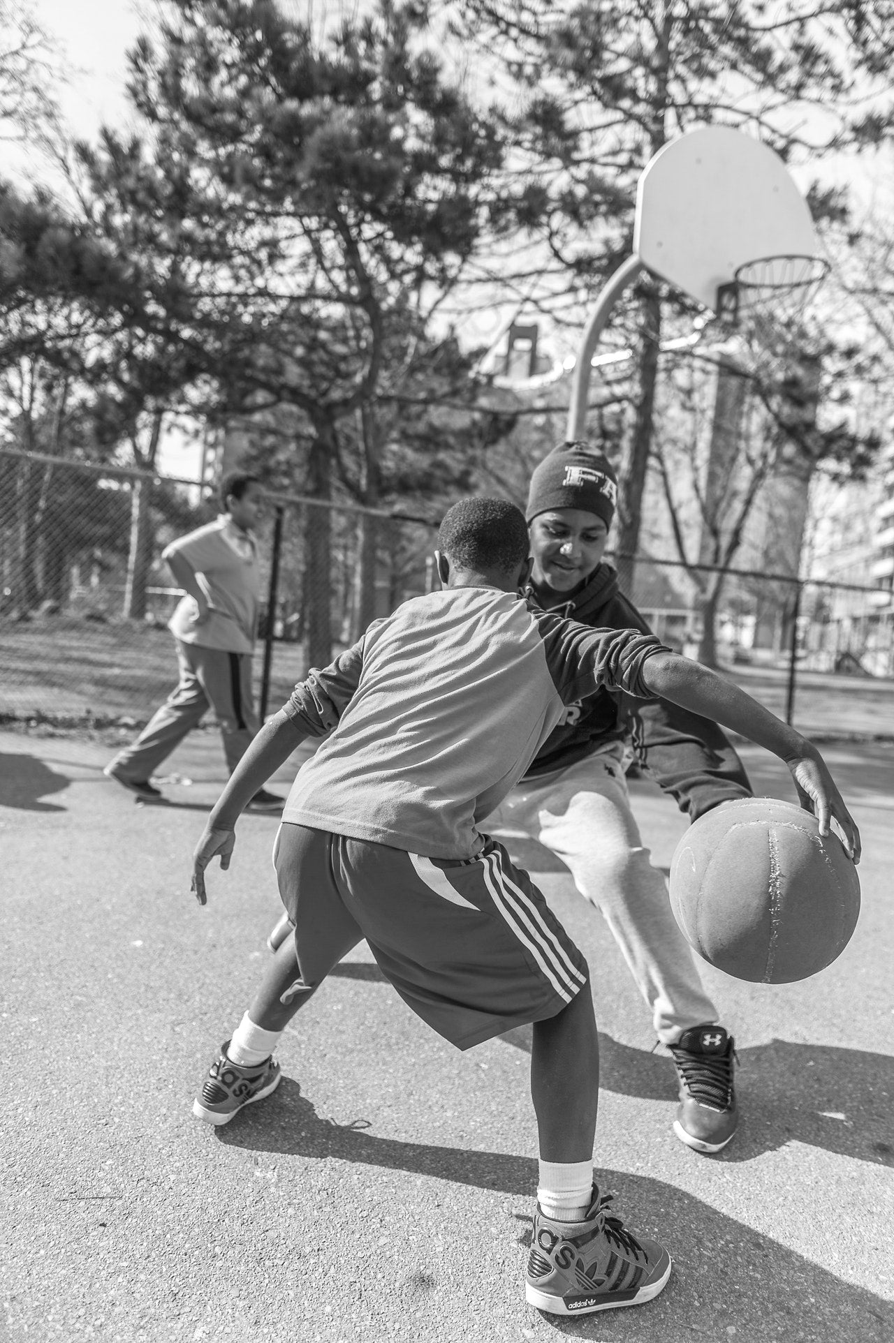 Dudes playing Street Basketball