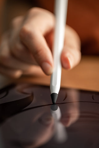 Person wearing a drawing glove and using PenTips Lite