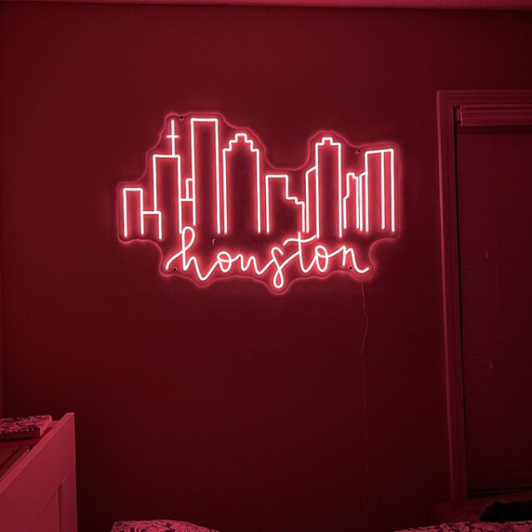 Customer's Houston Skyline Neon in the color red. Neon is installed on bedroom wall.