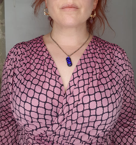 woman with a princess drop chain with asymmetric pendant