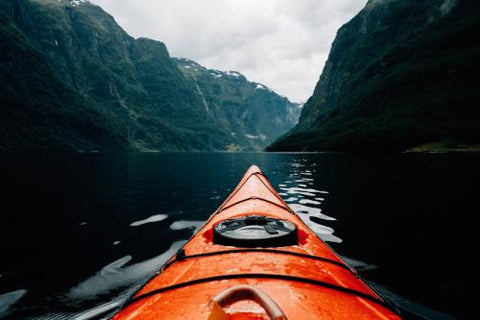 kayaking on a lake in the mountains. Fitneff Canada