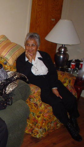 Maternal Grandmother "Gma" Muriel Hardeman's orange sofa chair with red roses and green leaves