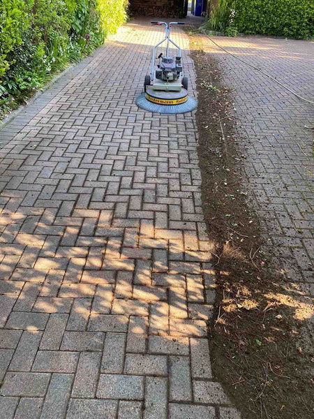 Block paving with moss removed by machine
