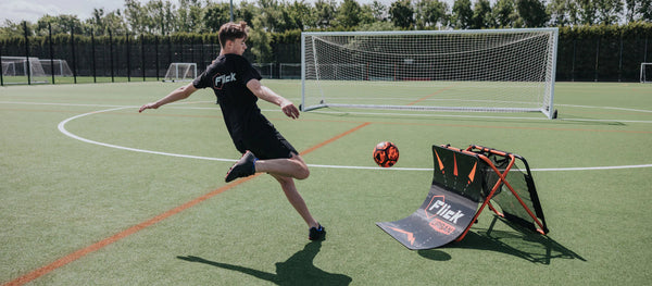 Flicks training kit in action with a football player kicking a ball