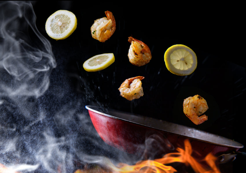 Tossing ingredients in skillet