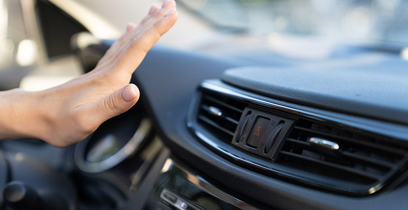 Hand on AC Dashboard