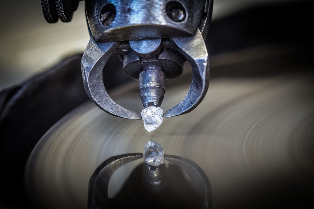 rough diamond at diamond polishing table at Royal Coster Diamonds