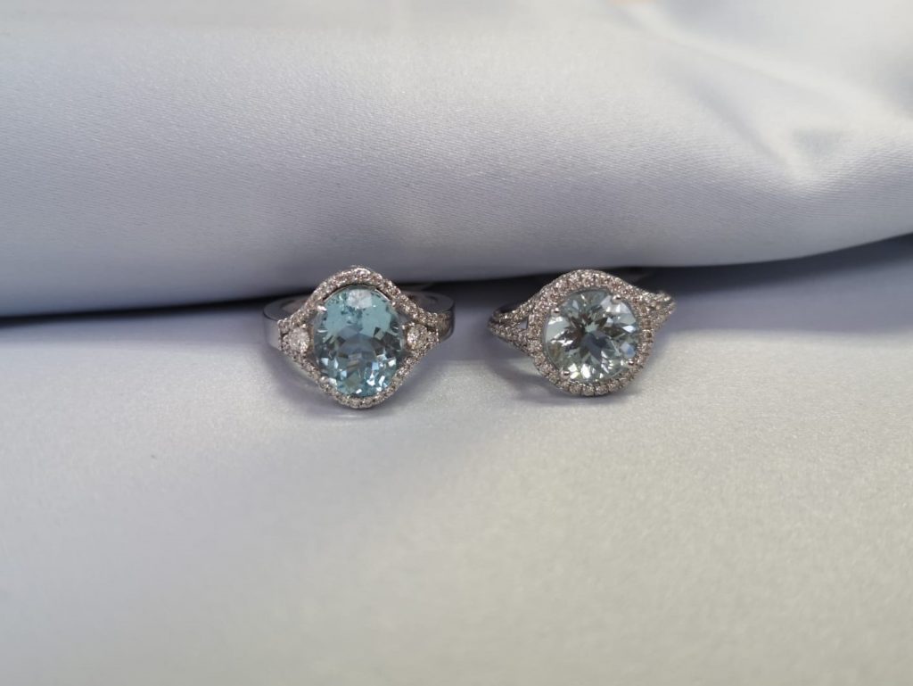 two rings with aquamarines and diamonds