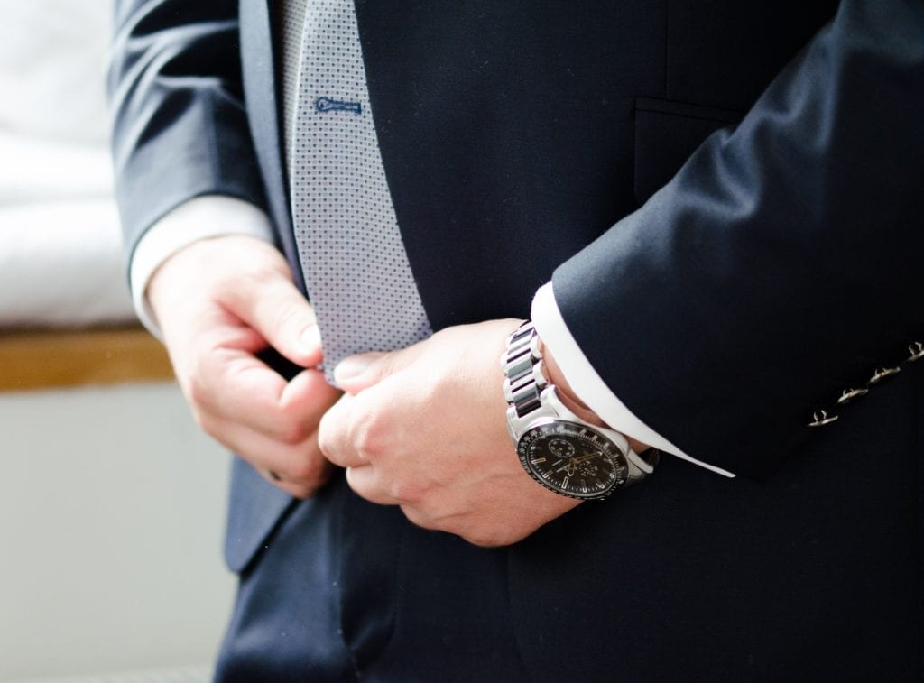man wearing a watch to his wedding