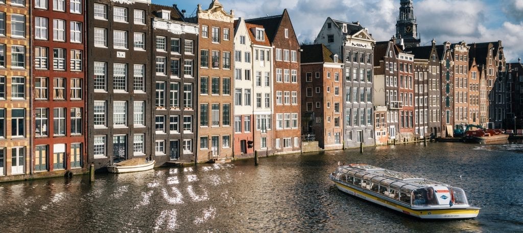 canal cruise in Amsterdam along old houses