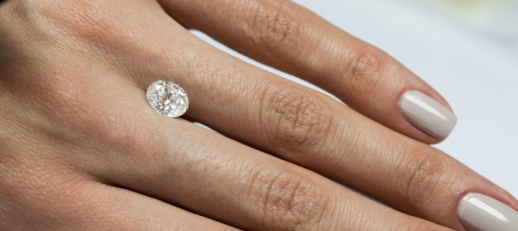 carat oval diamond on hand