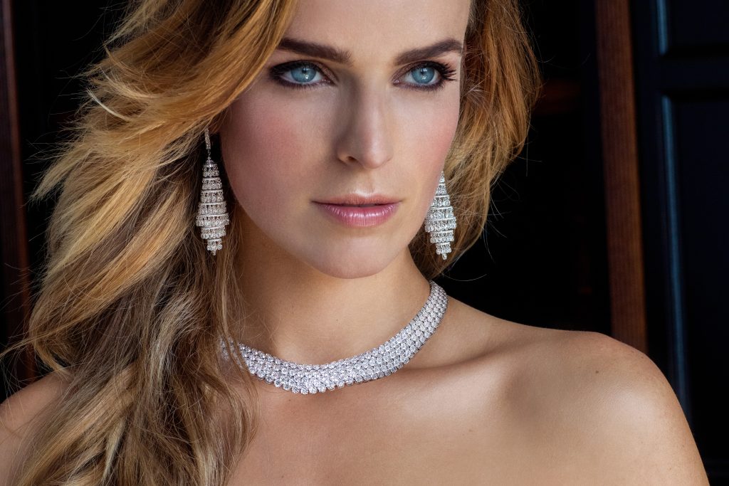 woman wearing diamond chandelier earrings