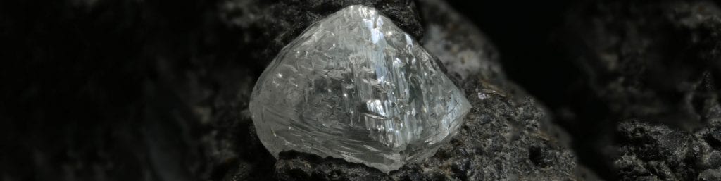 rough diamond in rocks
