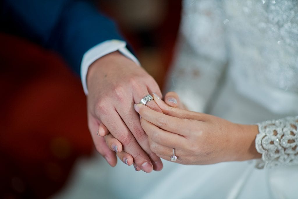 man wearing diamond wedding ring