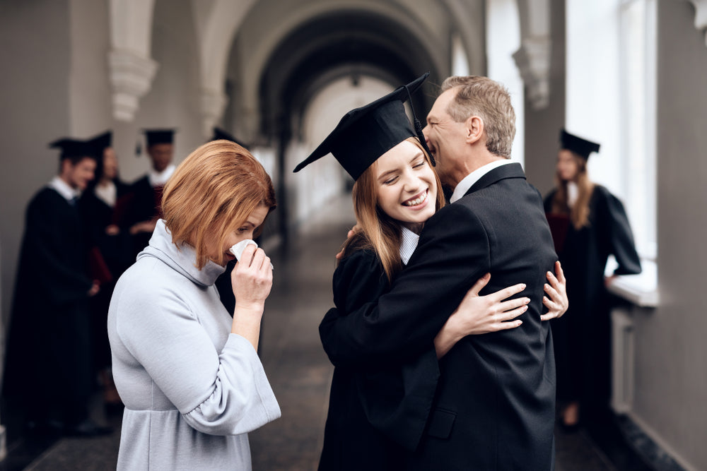 emotional parents at graduation daughter