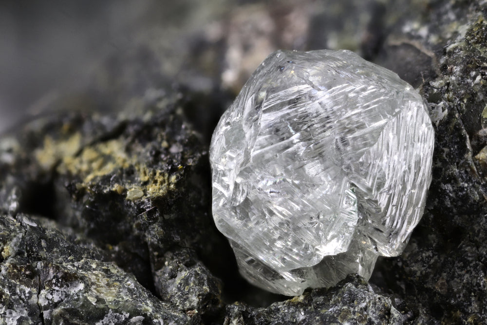 natural diamond in black rocks