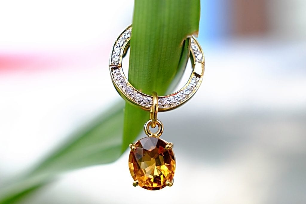 topaz earring in green leaf