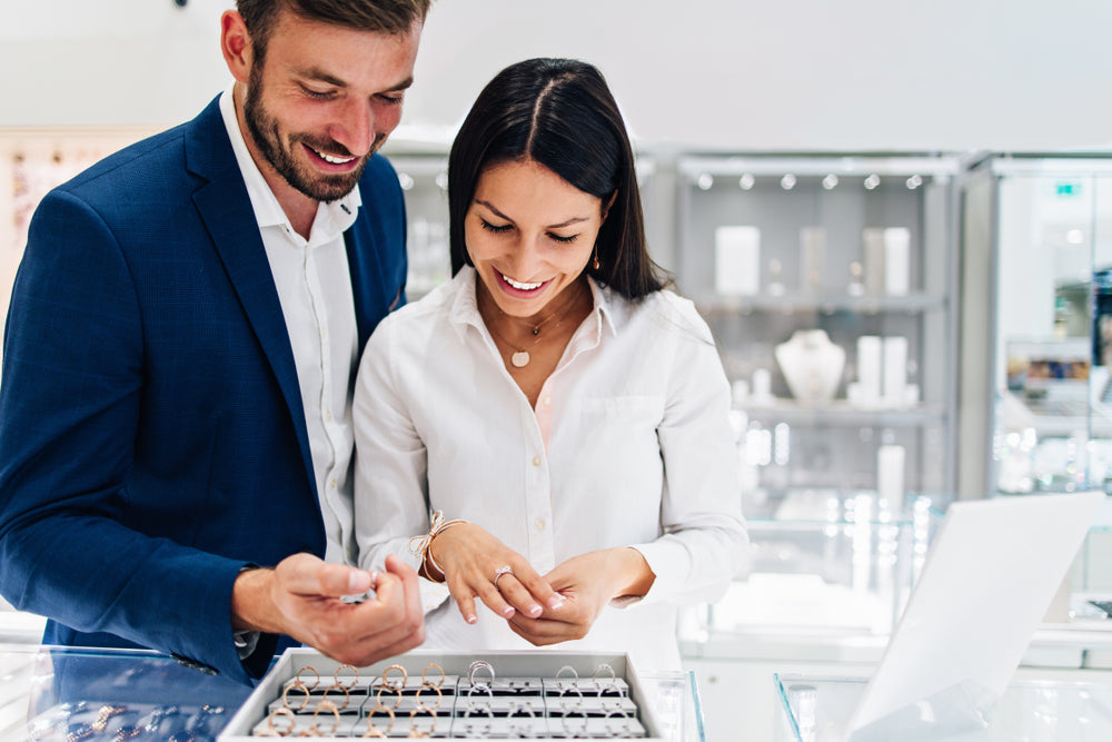 man and woman at jewelry store