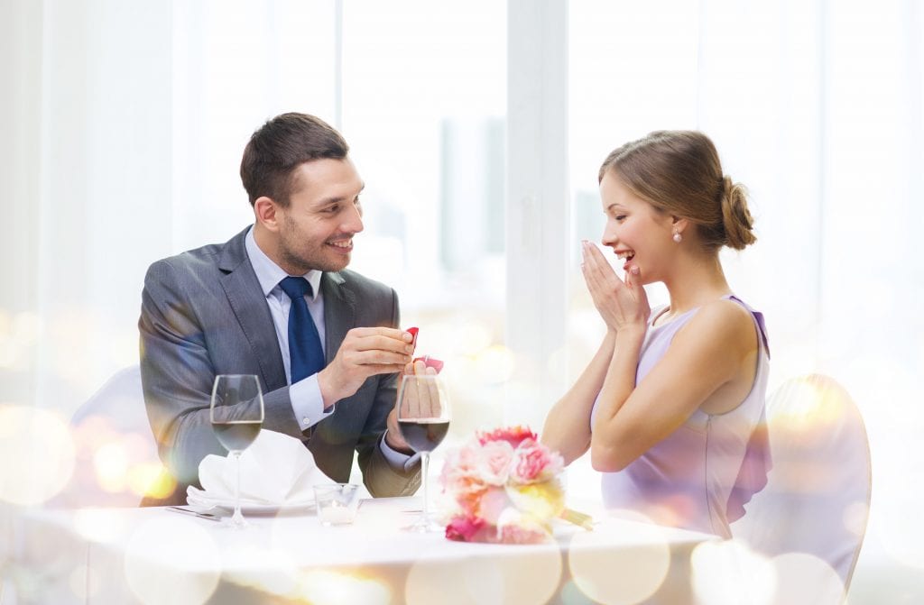 man giving diamond piece to his girlfriend