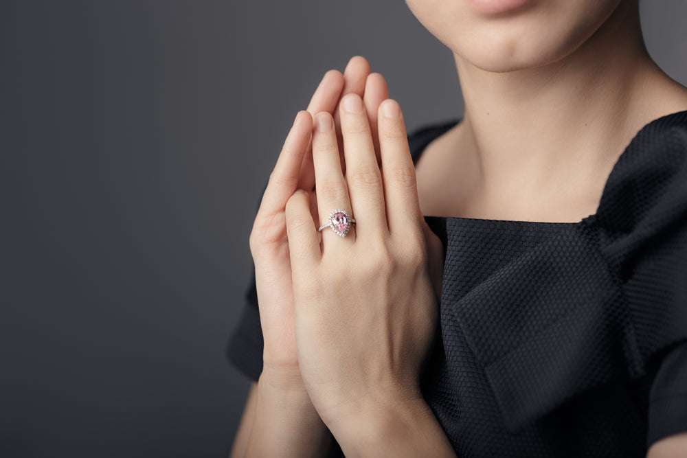 Woman wearing pear cut diamond ring