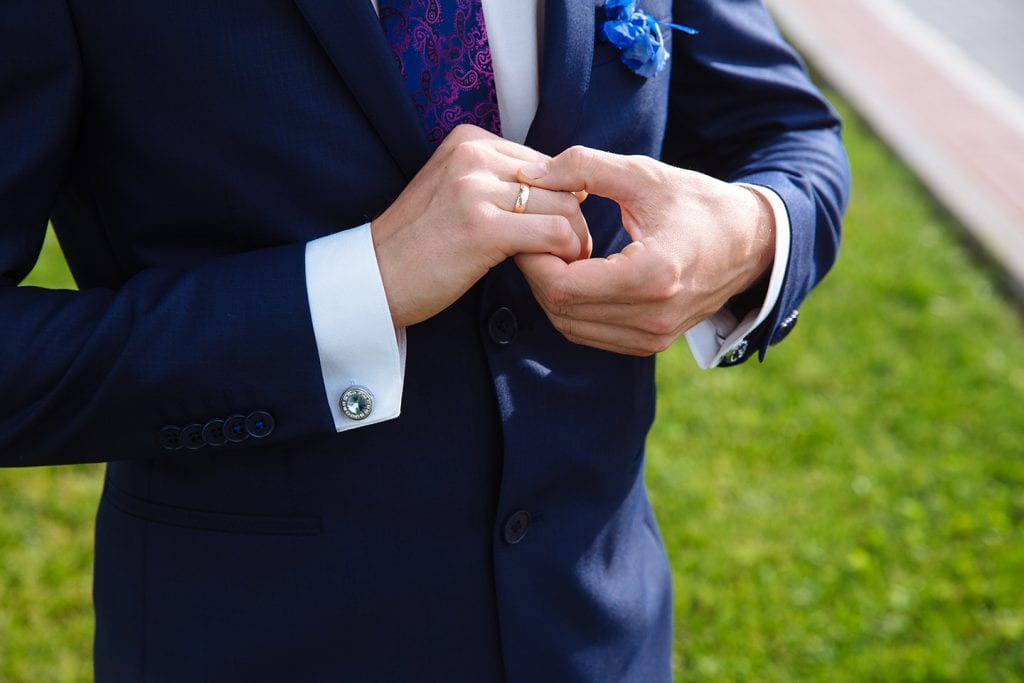 man wearing diamond cufflinks at wedding