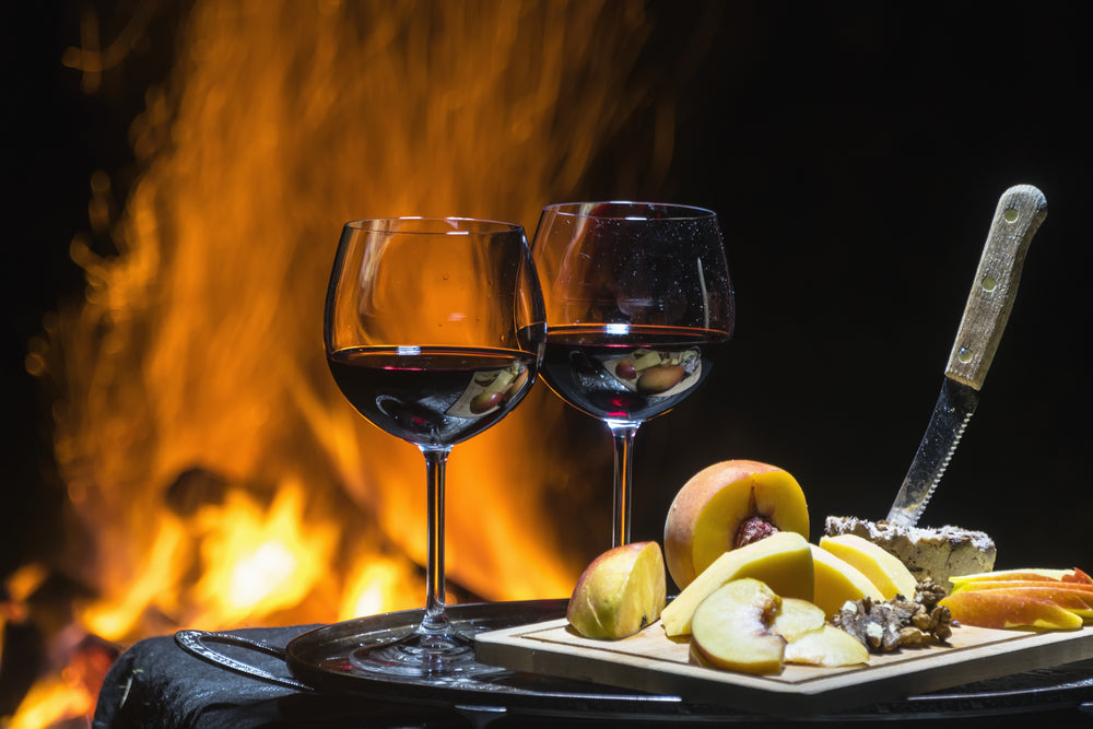 wine and cheese at fireplace