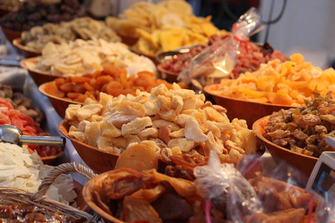 Bowls of various types of dehydrated fruit.
