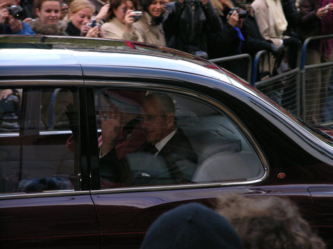 Queen Elizabeth and prince Philip in car