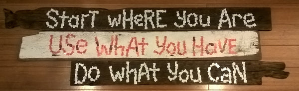 A sign (made out of bread bag ties) saying Start where you, Use what you have, Do what you can