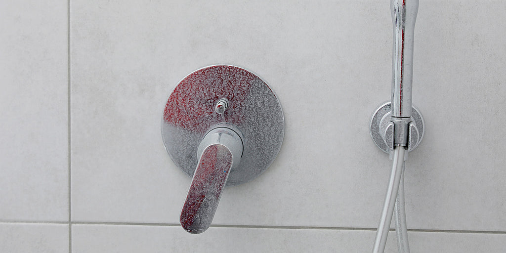 an image showcasing that the lime scales on a shower tap
