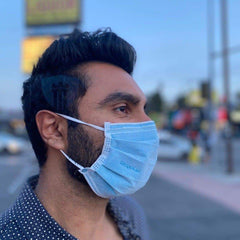 man wearing respokare antiviral mask outside