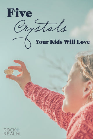 Five crystals to use with your kids - little girl holding a crystal