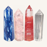 Four smelt quartz 'fake crystal' towers in blue, red, pink and clear