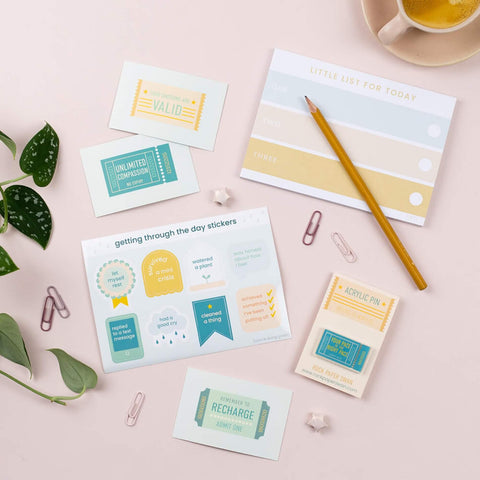 A self care stationary collection with notepad, stickers and self kindness slogans