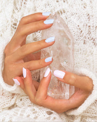 Woman holding a quartz crystal