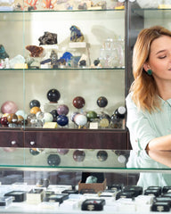 Counter of a crystal shop with crystal sphere on display