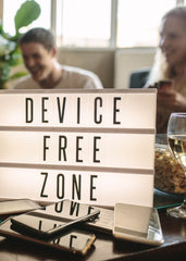 Device free zone sign with mobile phones