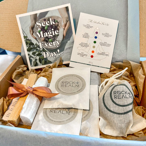 A plastic-free box of rock + realm products beautifully wrapped up