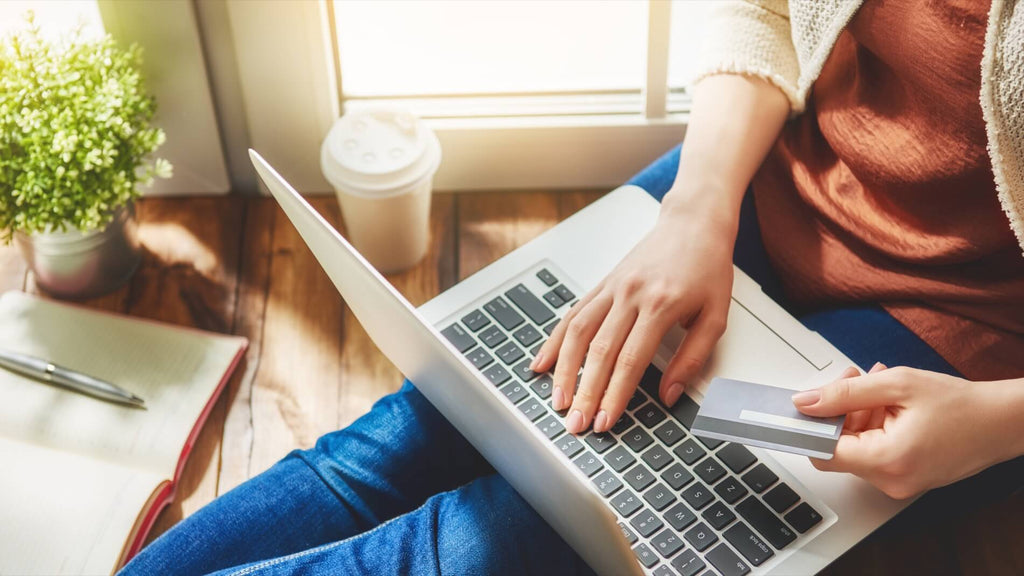 Woman shops online in her living room