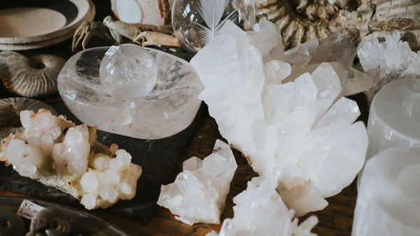 A table full of beautiful clear quartz crystals